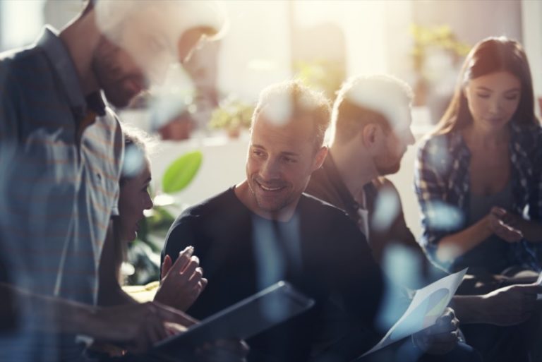 business people connected on internet network with a tablet. concept of startup company. double exposure