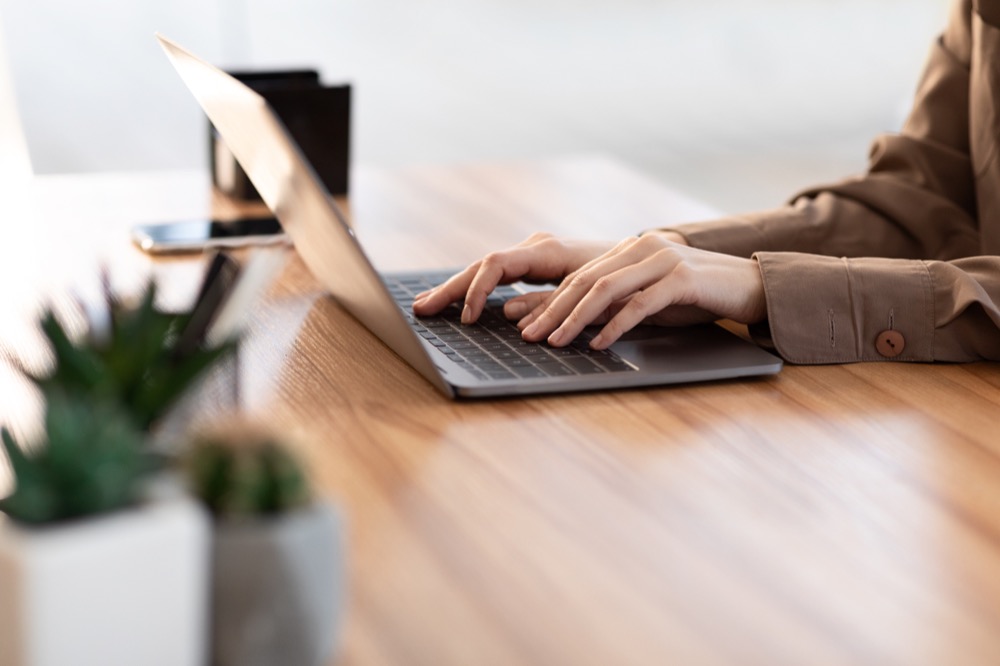 woman using her personal computer at home