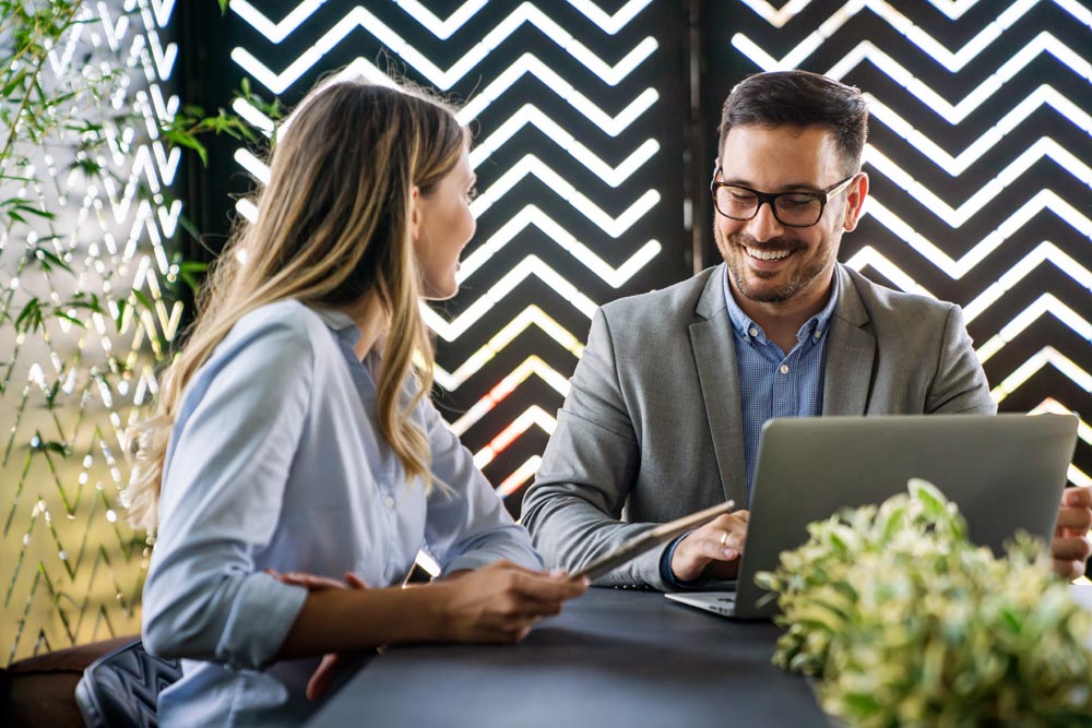 portrait of success business colleagues working, smiling together in office.