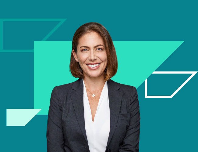Smiling businesswoman against teal geometric background